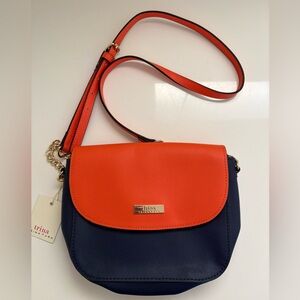 NWT Trina Turk Faux Leather Orange & Navy Blue Crossbody Bag. Adjustable straps